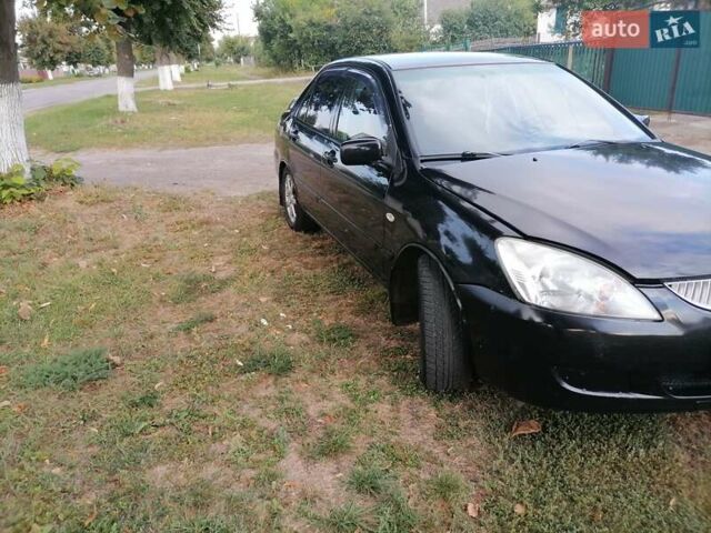 Чорний Міцубісі Lancer, об'ємом двигуна 1.58 л та пробігом 210 тис. км за 2999 $, фото 18 на Automoto.ua