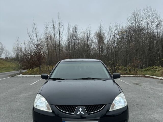 Черный Мицубиси Лансер, объемом двигателя 1.6 л и пробегом 200 тыс. км за 3500 $, фото 9 на Automoto.ua