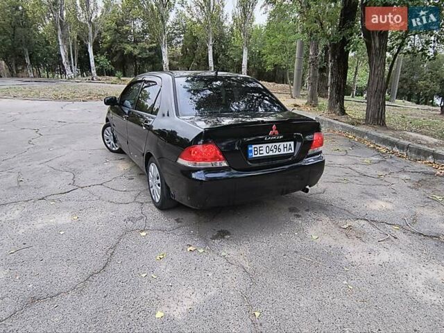 Черный Мицубиси Лансер, объемом двигателя 1.58 л и пробегом 352 тыс. км за 4000 $, фото 6 на Automoto.ua