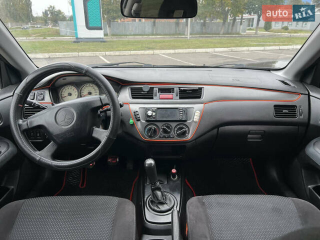 Черный Мицубиси Лансер, объемом двигателя 1.58 л и пробегом 300 тыс. км за 3850 $, фото 12 на Automoto.ua