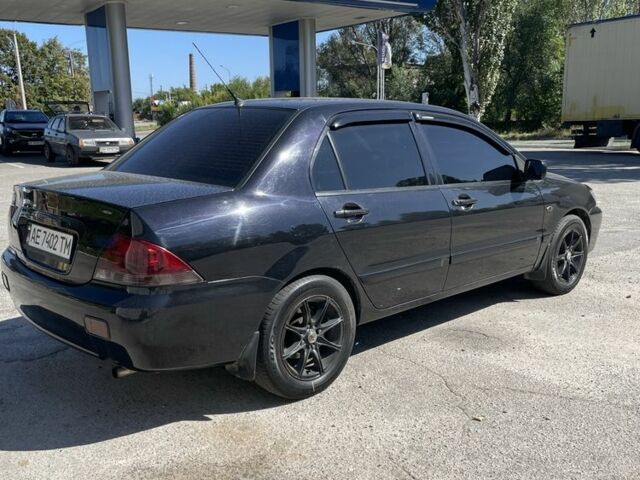 Чорний Міцубісі Lancer, об'ємом двигуна 1.6 л та пробігом 320 тис. км за 3599 $, фото 3 на Automoto.ua
