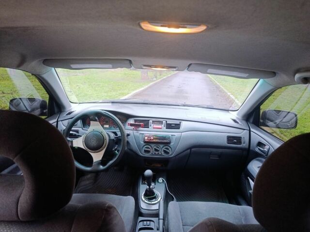 Черный Мицубиси Лансер, объемом двигателя 2 л и пробегом 275 тыс. км за 2599 $, фото 4 на Automoto.ua