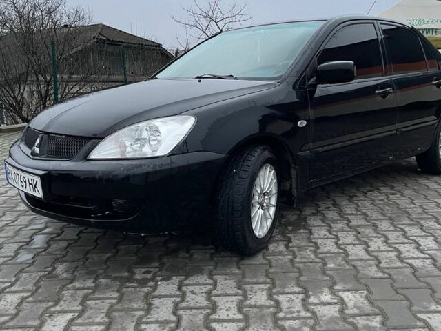 Черный Мицубиси Лансер, объемом двигателя 1.6 л и пробегом 240 тыс. км за 3499 $, фото 2 на Automoto.ua