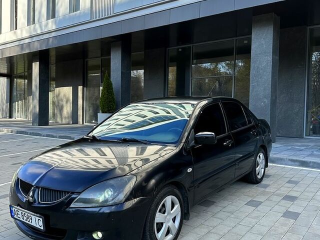 Чорний Міцубісі Lancer, об'ємом двигуна 1.6 л та пробігом 220 тис. км за 4699 $, фото 1 на Automoto.ua