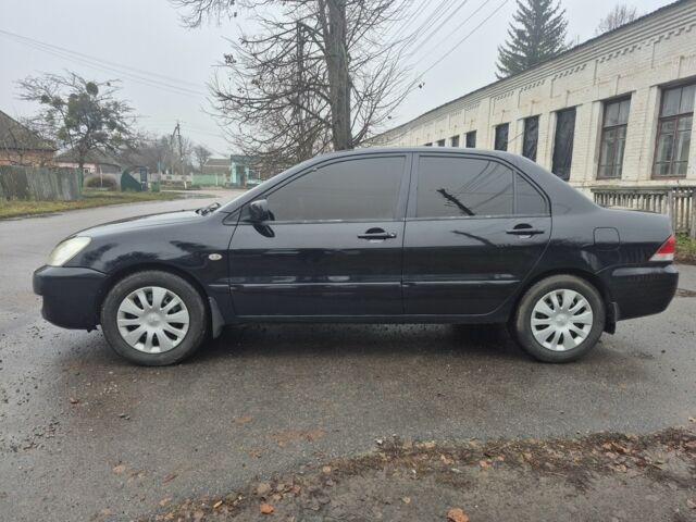 Черный Мицубиси Лансер, объемом двигателя 1.6 л и пробегом 280 тыс. км за 3200 $, фото 1 на Automoto.ua