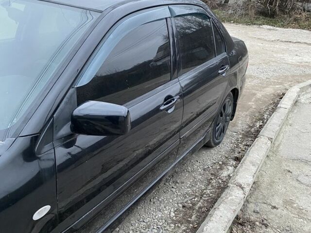 Чорний Міцубісі Lancer, об'ємом двигуна 1.6 л та пробігом 250 тис. км за 3500 $, фото 6 на Automoto.ua