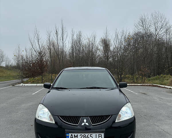 Черный Мицубиси Лансер, объемом двигателя 1.6 л и пробегом 200 тыс. км за 3499 $, фото 6 на Automoto.ua