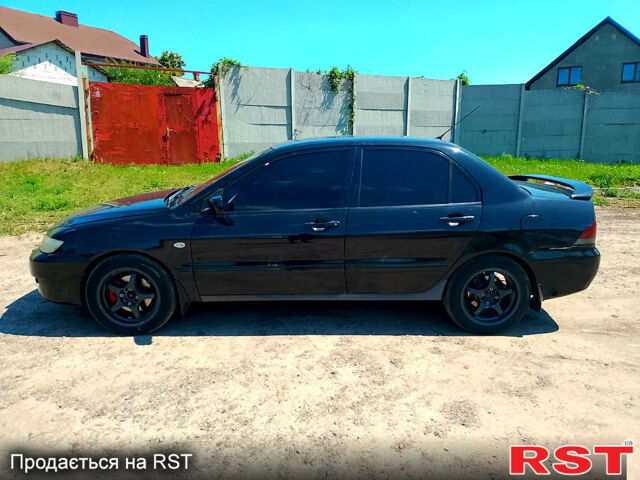 Черный Мицубиси Лансер, объемом двигателя 1.6 л и пробегом 230 тыс. км за 2650 $, фото 6 на Automoto.ua