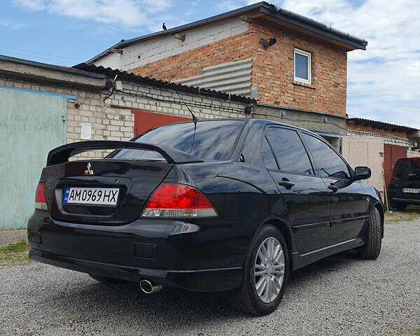 Черный Мицубиси Лансер, объемом двигателя 1.58 л и пробегом 154 тыс. км за 5500 $, фото 46 на Automoto.ua