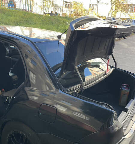 Черный Мицубиси Лансер, объемом двигателя 1.6 л и пробегом 200 тыс. км за 3000 $, фото 12 на Automoto.ua