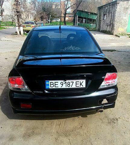 Чорний Міцубісі Lancer, об'ємом двигуна 2 л та пробігом 265 тис. км за 4000 $, фото 4 на Automoto.ua