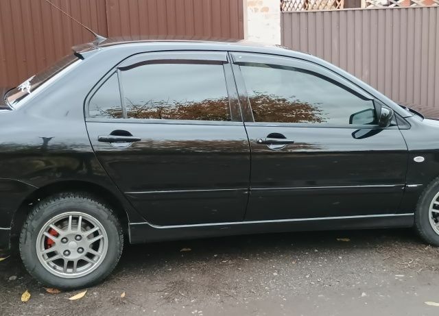 Чорний Міцубісі Lancer, об'ємом двигуна 1.6 л та пробігом 261 тис. км за 4400 $, фото 2 на Automoto.ua