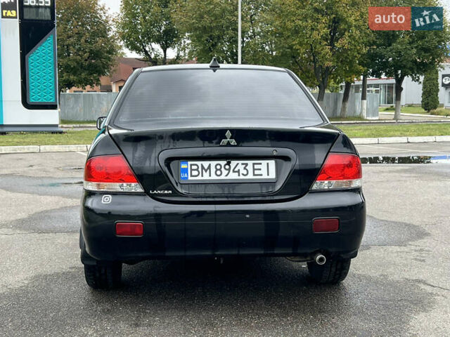 Черный Мицубиси Лансер, объемом двигателя 1.58 л и пробегом 300 тыс. км за 3850 $, фото 5 на Automoto.ua