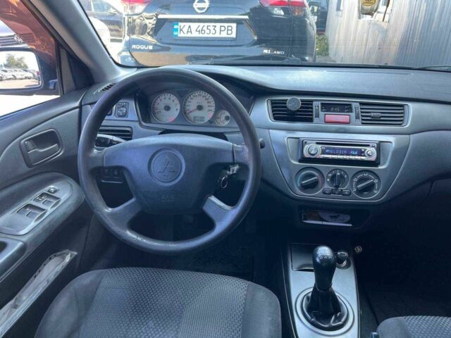 Чорний Міцубісі Lancer, об'ємом двигуна 2 л та пробігом 310 тис. км за 4990 $, фото 13 на Automoto.ua