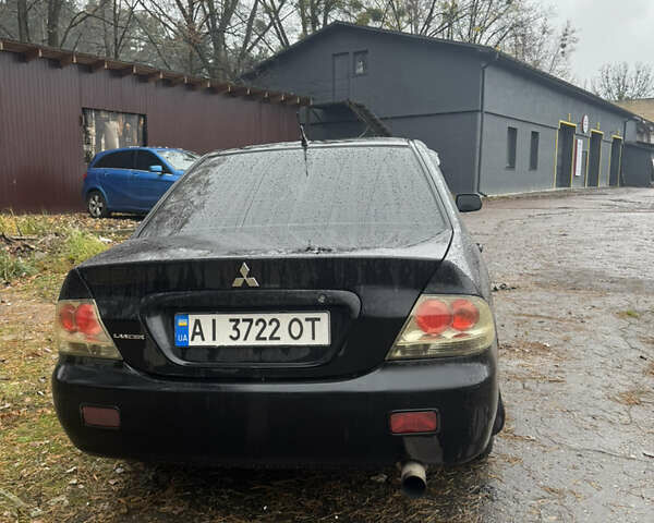 Черный Мицубиси Лансер, объемом двигателя 1.58 л и пробегом 264 тыс. км за 4600 $, фото 6 на Automoto.ua