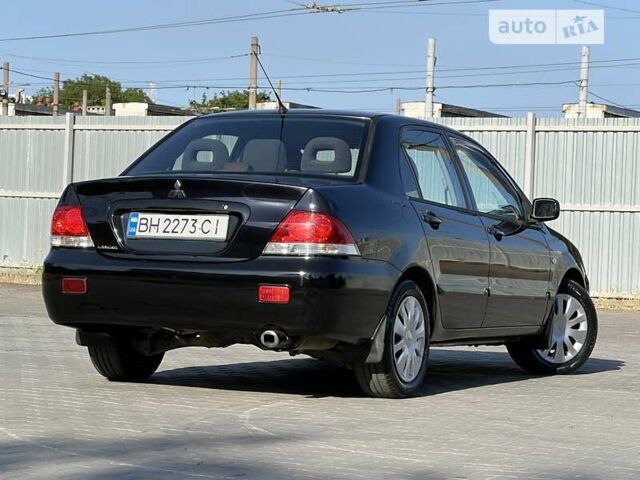 Чорний Міцубісі Lancer, об'ємом двигуна 1.58 л та пробігом 252 тис. км за 4300 $, фото 31 на Automoto.ua