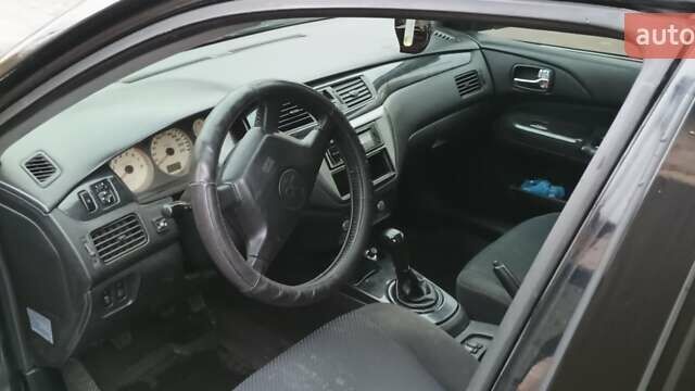 Черный Мицубиси Лансер, объемом двигателя 1.58 л и пробегом 261 тыс. км за 4400 $, фото 1 на Automoto.ua