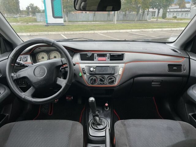 Черный Мицубиси Лансер, объемом двигателя 1.6 л и пробегом 390 тыс. км за 4000 $, фото 8 на Automoto.ua