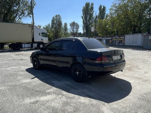 Чорний Міцубісі Lancer, об'ємом двигуна 1.6 л та пробігом 320 тис. км за 3599 $, фото 4 на Automoto.ua