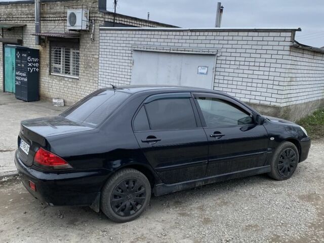Чорний Міцубісі Lancer, об'ємом двигуна 1.6 л та пробігом 250 тис. км за 3500 $, фото 4 на Automoto.ua