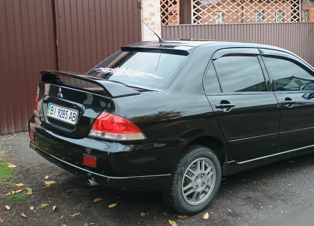 Чорний Міцубісі Lancer, об'ємом двигуна 1.6 л та пробігом 261 тис. км за 4400 $, фото 3 на Automoto.ua