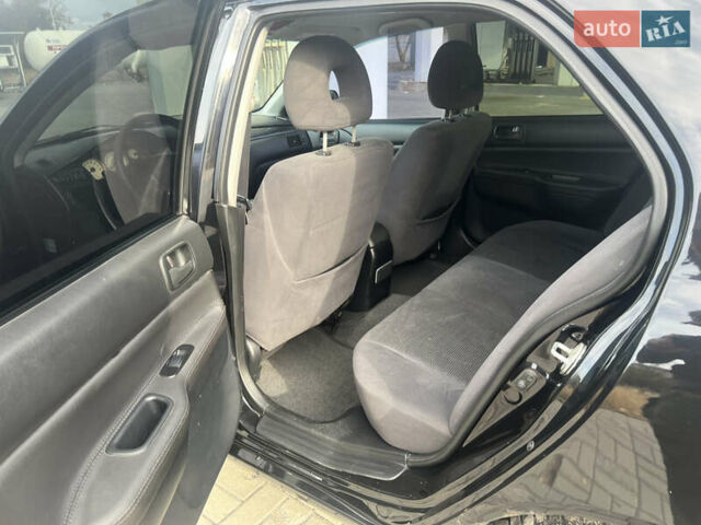Чорний Міцубісі Lancer, об'ємом двигуна 1.58 л та пробігом 364 тис. км за 4000 $, фото 10 на Automoto.ua