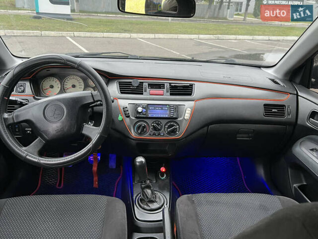 Чорний Міцубісі Lancer, об'ємом двигуна 1.58 л та пробігом 390 тис. км за 4500 $, фото 11 на Automoto.ua