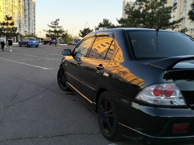 Чорний Міцубісі Lancer, об'ємом двигуна 2 л та пробігом 260 тис. км за 5800 $, фото 3 на Automoto.ua