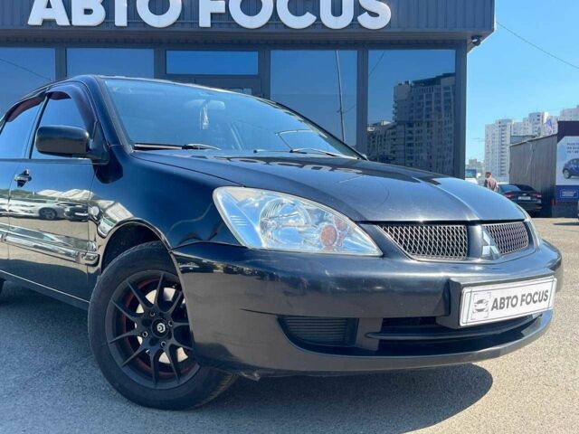 Чорний Міцубісі Lancer, об'ємом двигуна 2 л та пробігом 310 тис. км за 4990 $, фото 1 на Automoto.ua