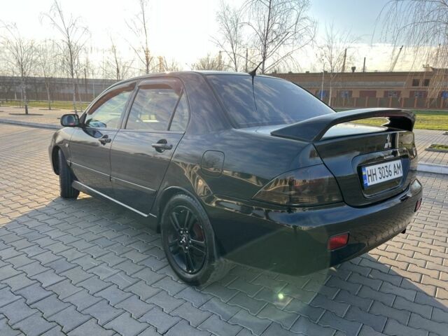 Чорний Міцубісі Lancer, об'ємом двигуна 2 л та пробігом 261 тис. км за 2700 $, фото 12 на Automoto.ua