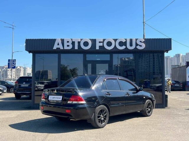 Чорний Міцубісі Lancer, об'ємом двигуна 2 л та пробігом 310 тис. км за 4990 $, фото 7 на Automoto.ua