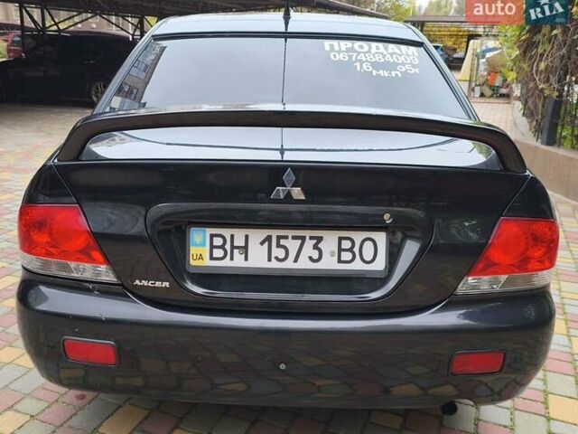 Мицубиси Лансер 2005 в Одессе на Automoto.ua Черный Мицубиси Лансер, объемом двигателя 1.58 л и пробегом 206 тыс. км за 3900 $, фото 4 на Automoto.ua