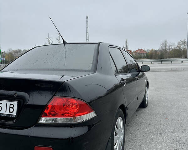 Черный Мицубиси Лансер, объемом двигателя 1.6 л и пробегом 200 тыс. км за 3499 $, фото 2 на Automoto.ua