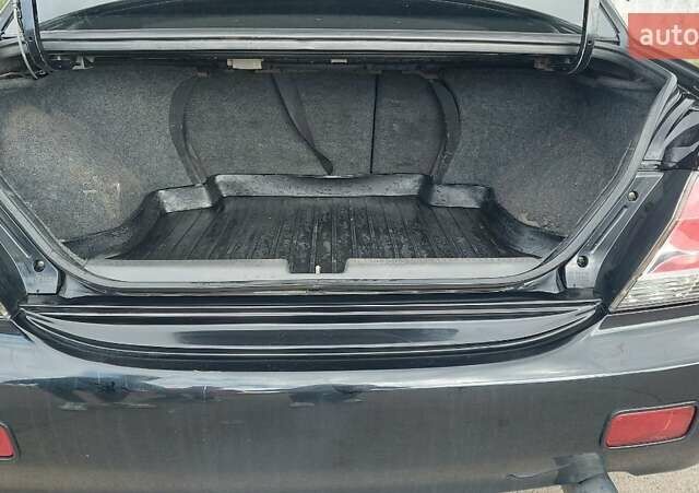 Черный Мицубиси Лансер, объемом двигателя 2 л и пробегом 225 тыс. км за 4400 $, фото 6 на Automoto.ua