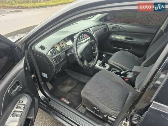 Черный Мицубиси Лансер, объемом двигателя 1.58 л и пробегом 280 тыс. км за 3200 $, фото 10 на Automoto.ua