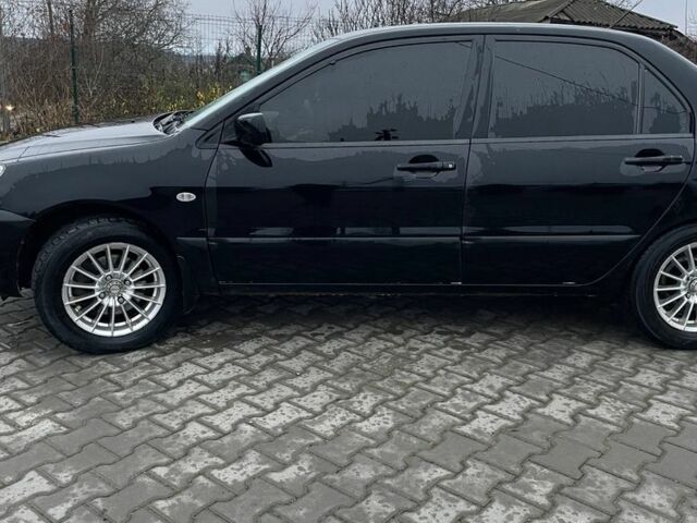 Черный Мицубиси Лансер, объемом двигателя 1.6 л и пробегом 240 тыс. км за 3499 $, фото 4 на Automoto.ua