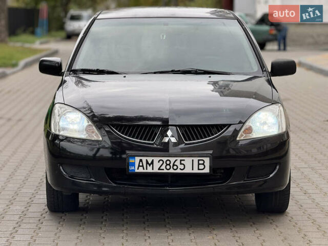 Черный Мицубиси Лансер, объемом двигателя 1.6 л и пробегом 200 тыс. км за 3499 $, фото 4 на Automoto.ua