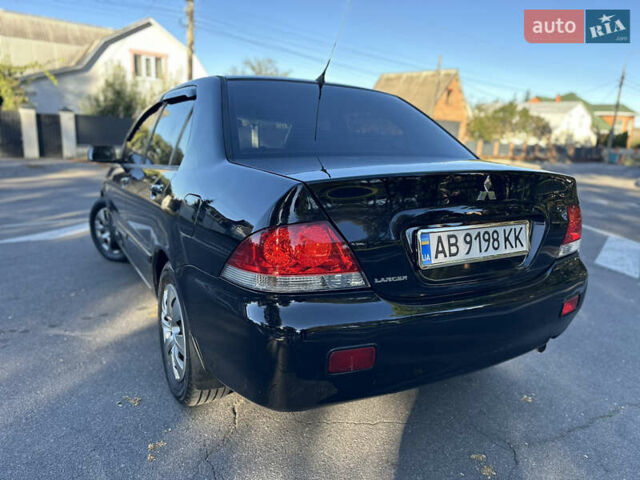 Мицубиси Лансер 2005 в Виннице на Automoto.ua Черный Мицубиси Лансер, объемом двигателя 1.6 л и пробегом 261 тыс. км за 4100 $, фото 25 на Automoto.ua