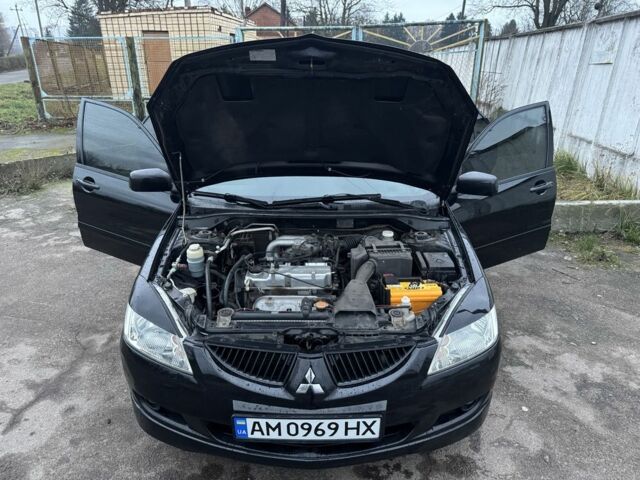 Чорний Міцубісі Lancer, об'ємом двигуна 1.6 л та пробігом 154 тис. км за 5500 $, фото 16 на Automoto.ua