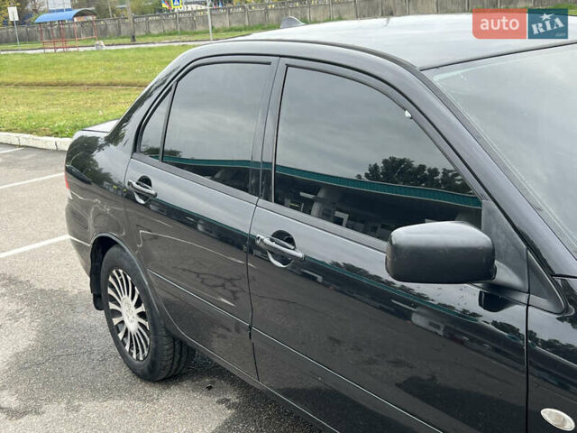 Черный Мицубиси Лансер, объемом двигателя 1.58 л и пробегом 300 тыс. км за 3850 $, фото 8 на Automoto.ua