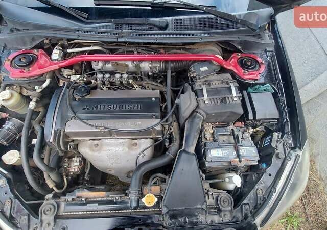 Черный Мицубиси Лансер, объемом двигателя 2 л и пробегом 225 тыс. км за 4400 $, фото 16 на Automoto.ua