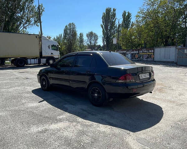 Чорний Міцубісі Lancer, об'ємом двигуна 1.58 л та пробігом 320 тис. км за 3600 $, фото 4 на Automoto.ua