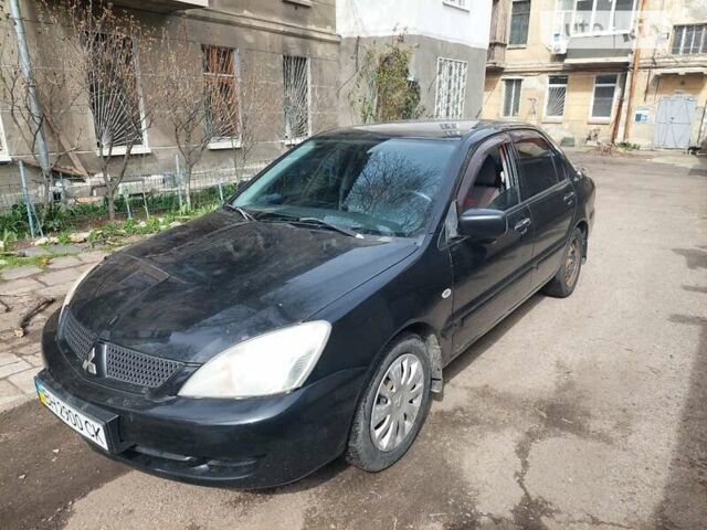 Чорний Міцубісі Lancer, об'ємом двигуна 1.58 л та пробігом 300 тис. км за 4000 $, фото 7 на Automoto.ua