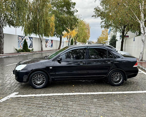 Черный Мицубиси Лансер, объемом двигателя 1.58 л и пробегом 236 тыс. км за 4300 $, фото 7 на Automoto.ua