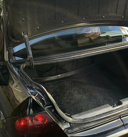 Черный Мицубиси Лансер, объемом двигателя 1.6 л и пробегом 200 тыс. км за 3000 $, фото 8 на Automoto.ua