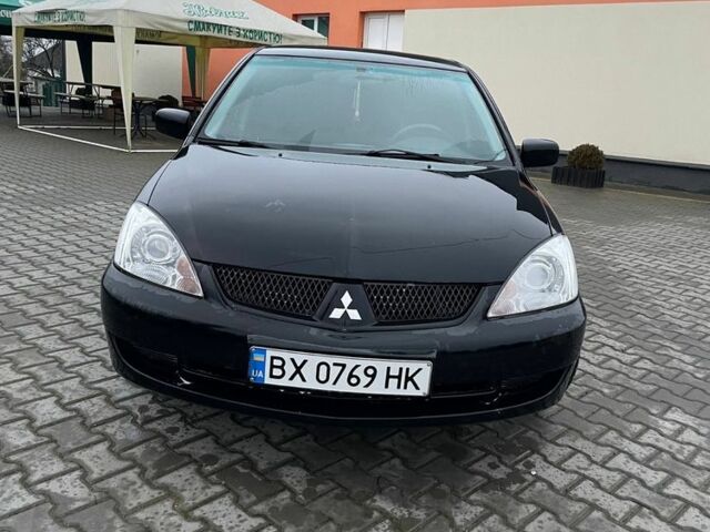 Черный Мицубиси Лансер, объемом двигателя 1.6 л и пробегом 240 тыс. км за 3499 $, фото 5 на Automoto.ua