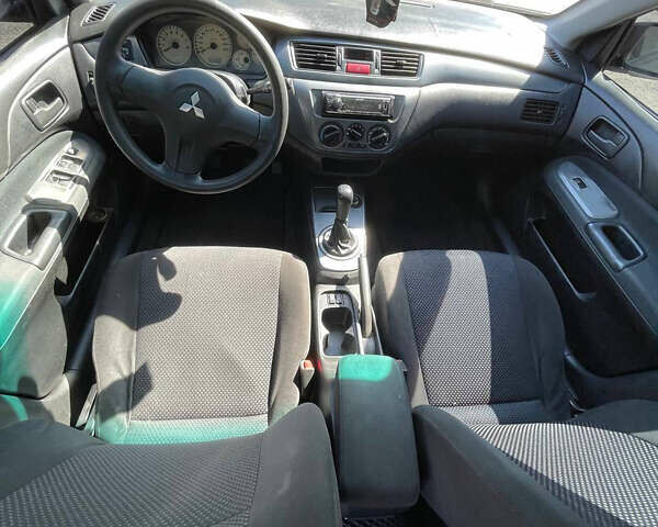Чорний Міцубісі Lancer, об'ємом двигуна 1.58 л та пробігом 320 тис. км за 3600 $, фото 5 на Automoto.ua
