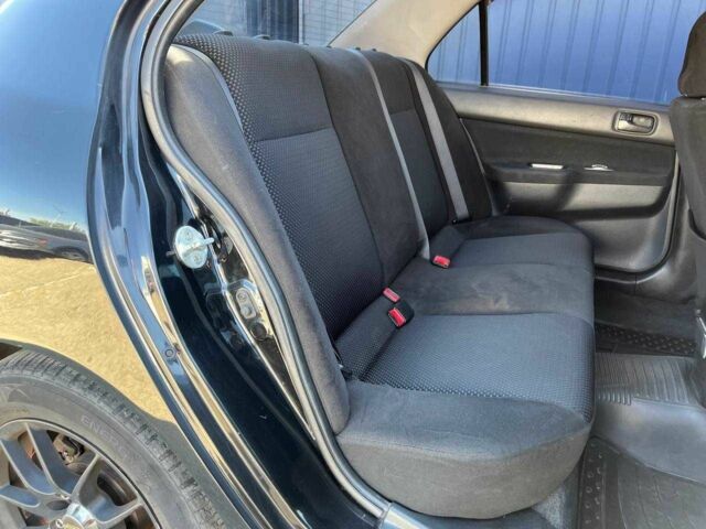 Чорний Міцубісі Lancer, об'ємом двигуна 2 л та пробігом 310 тис. км за 4990 $, фото 10 на Automoto.ua