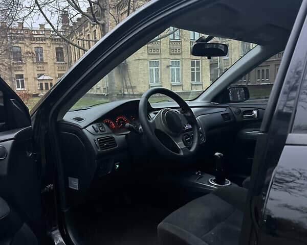Чорний Міцубісі Lancer, об'ємом двигуна 2 л та пробігом 250 тис. км за 3999 $, фото 7 на Automoto.ua