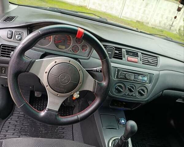 Черный Мицубиси Лансер, объемом двигателя 2 л и пробегом 225 тыс. км за 4400 $, фото 12 на Automoto.ua